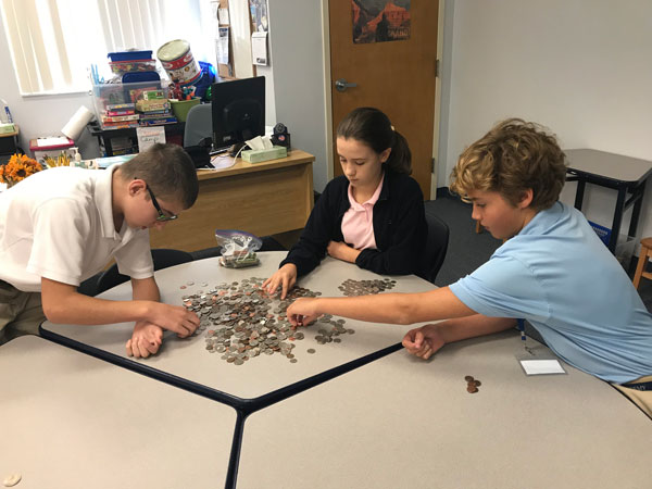 Rosarian collects change to aid hurricane victims